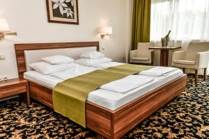 Voodi või voodid majutusasutuse Simbad Hotel & Bar Superior toas