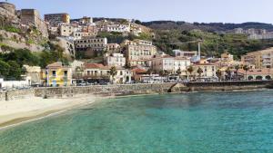 a view of a town with a beach and buildings at Casa Lucilla in Pizzo