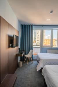 Voodi või voodid majutusasutuse Edelweiss Art Hotel toas