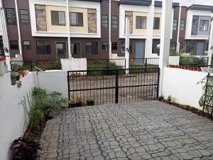 a gate in front of a building at Phirst Park Homes Townhouse in Lipa