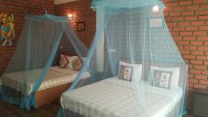 Postel nebo postele na pokoji v ubytování Ayubo Ella - Bed & Breakfast