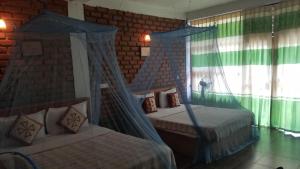 Postel nebo postele na pokoji v ubytování Ayubo Ella - Bed & Breakfast