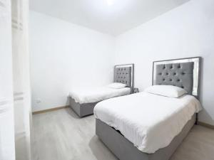 Łóżko lub łóżka w pokoju w obiekcie La coulée verte