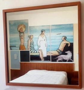 a framed picture of a painting of people at Hotel Royal in Giulianova