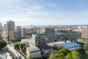 an aerial view of a city with buildings and the ocean at Apartamentos Michel Angelo Benidorm in Benidorm +67 photos