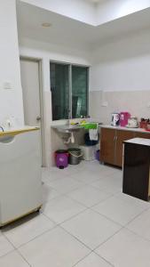 a large room with a kitchen with a sink at Sekinchan Paddy via Seaview Home in Sekincan