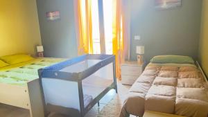 Postel nebo postele na pokoji v ubytování B&B LAVIKA PEDARA