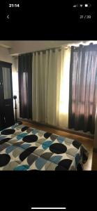 a room with a black and white checkered floor at 2 Bedroom Condo Unit in Manila