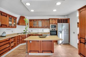 A kitchen or kitchenette at Villa Maday