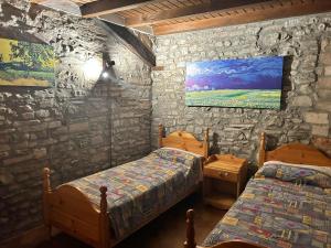 A bed or beds in a room at La Baita da Nino