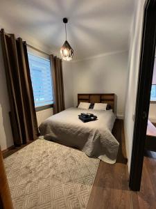 Postel nebo postele na pokoji v ubytování EVIS LTD apartments 3