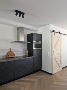 Η κουζίνα ή μικρή κουζίνα στο Nest Lodge