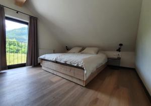 Ένα ή περισσότερα κρεβάτια σε δωμάτιο στο Nest Lodge