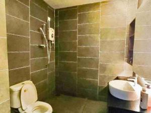 a bathroom with a toilet and a sink at Montana Suites 3, Empire Damansara in Petaling Jaya