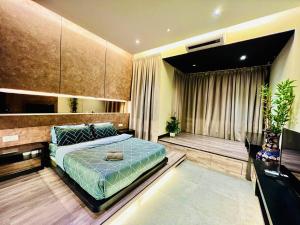 a bedroom with a large bed and a balcony at Montana Suites 3, Empire Damansara in Petaling Jaya
