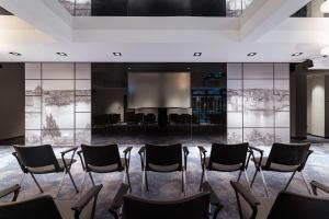 a conference room with chairs and a projection screen at The Embassy Valletta Hotel in Valletta