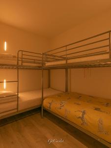 a bedroom with two bunk beds in a room at Luxueus genieten aan zee: private jacuzzi en sauna in Knokke-Heist +5 photos