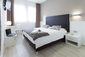 Postel nebo postele na pokoji v ubytování Hotel Centrale