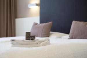 Postel nebo postele na pokoji v ubytování Hotel Centrale