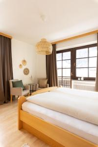 Ένα ή περισσότερα κρεβάτια σε δωμάτιο στο Der Thomataler Wirt