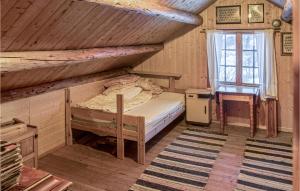 a bedroom with a bunk bed and a window at 2 Bedroom Stunning Home In len in Ålen