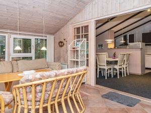 a living room with a couch and a table at 5 person holiday home in Herning in Kølkær