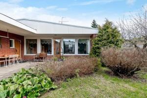 a brick house with a porch and a patio at Omakotitalo, Pansio (near Meyer gate) in Turku