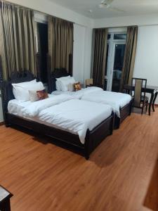 Cama o camas de una habitación en ASHOK VILLA