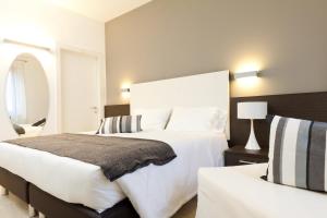 Postel nebo postele na pokoji v ubytování Hotel Centrale