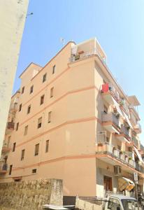 a tall building with a car parked in front of it at Casa Marinella in Vico Equense