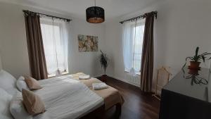 Postel nebo postele na pokoji v ubytování Bíbic Apartman A