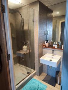 a bathroom with a shower and a sink and a sink at Cosy and spacious apartment in Forest Hill in Forest Hill
