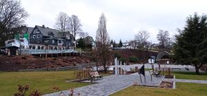 a park with a house on a hill with a building at Winterberg Centrum with SommerCard and bicycle cellar in Winterberg