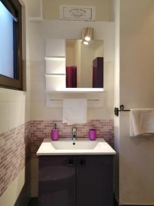 a bathroom with a sink and a mirror at La Casetta in San Maurizio Canavese