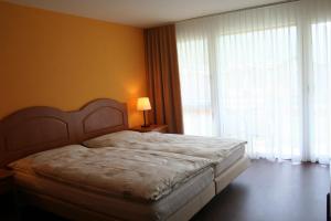 Letto o letti in una camera di Welcome Hotel Täsch by Täscherhof