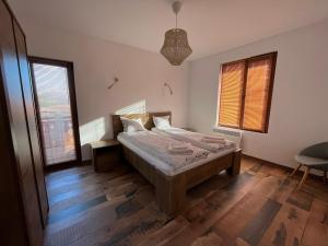 A bed or beds in a room at Farmhopping Village