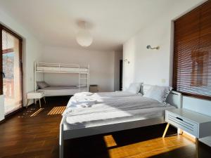 A bed or beds in a room at Farmhopping Village