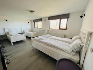 A bed or beds in a room at Farmhopping Village