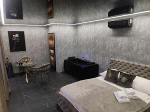 a hotel room with a bed and a table with a table at Wrzos in Poznań