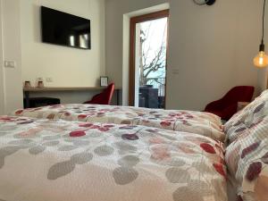 Postel nebo postele na pokoji v ubytování B&B NALÙ