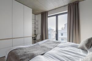 מיטה או מיטות בחדר ב-Aparthotel Na Klenici