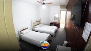 Postel nebo postele na pokoji v ubytování Pousada Casa da Praia