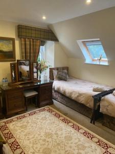 The West Highland Way Hotel Accommodation客房内的一张或多张床位