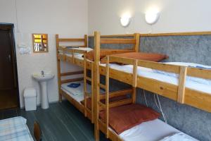 Voodi või voodid majutusasutuse Hotel Sklárna Harrachov toas