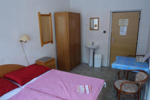 Voodi või voodid majutusasutuse Hotel Sklárna Harrachov toas
