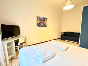 A bed or beds in a room at La Dolce Vita - Navigli