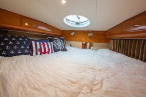 a large bed in the middle of a boat at Sea Pearl Boston Yacht in Boston