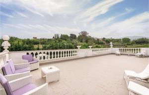 A balcony or terrace at 2 Bedroom Stunning Home In Roma