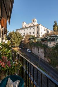 a balcony with a view of a building and a street at NAMAN HOTELLERIE - Spagna in Rome