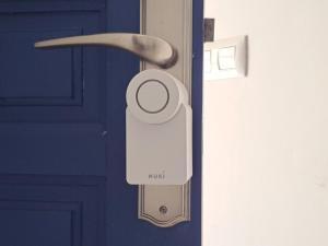 a close up of a door with a padlock on it at la ventana al mar in Jávea
